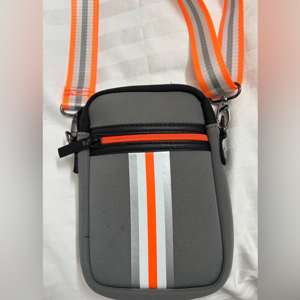 Gray and Orange Crossbody Bag. Adjustable orange and white strap.